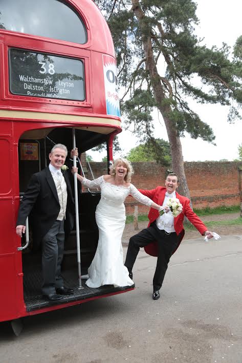 Glen hanging off double decker bus
